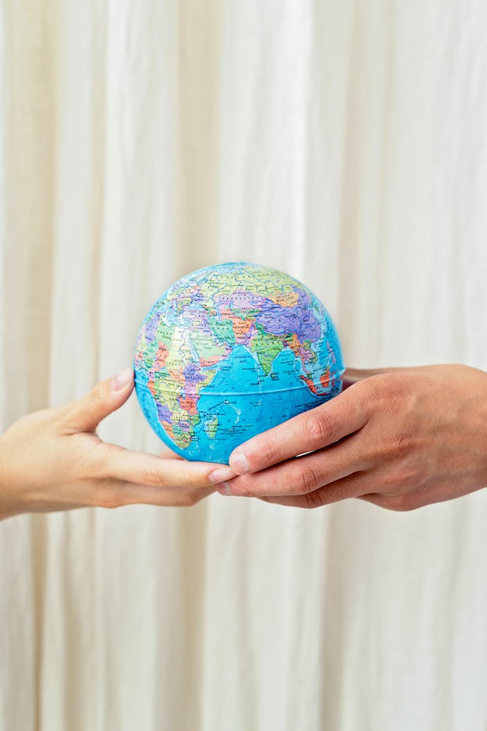 contact-img Photo depicting hands holding a globe, symbolizing unity and world peace.
