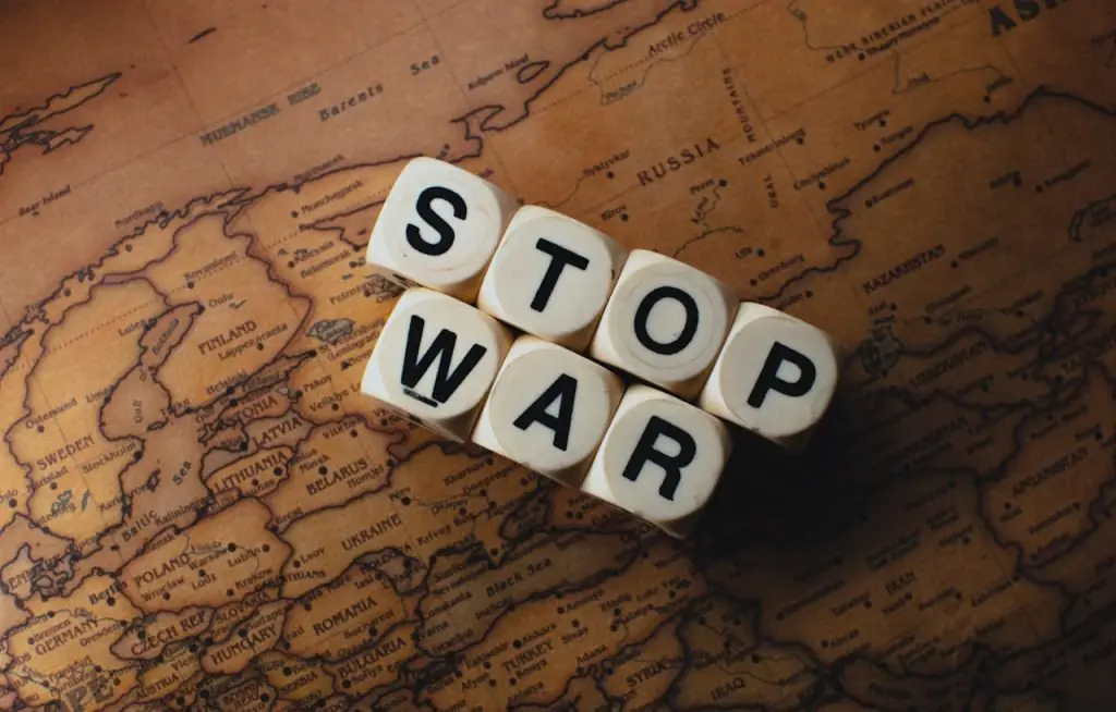dice-with-letters-on-a-map-11816424 Dice with STOP WAR on a vintage world map signifies peace.