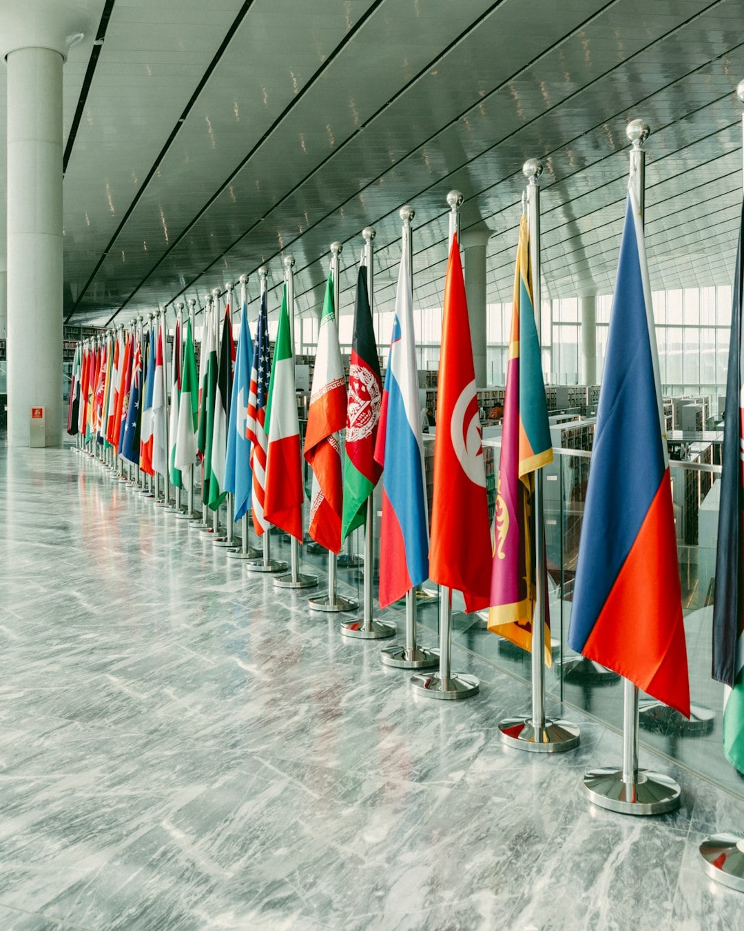 gallery-4 A long line of world flags inside a bright modern hall