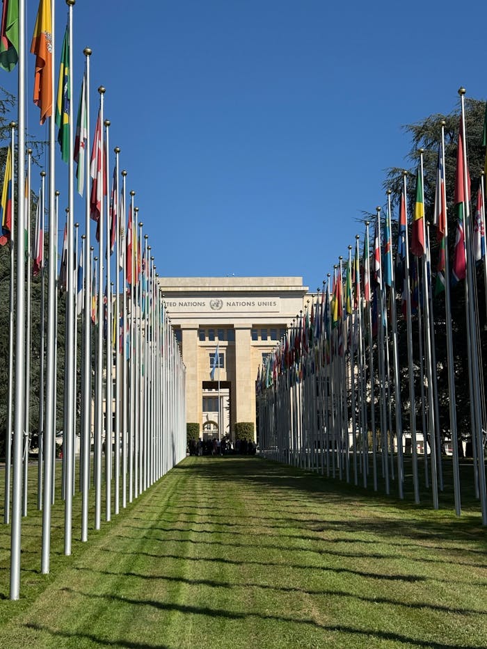 gallery-6 Flags line the pathway to the United Nations building in Geneva, Switzerland on a sunny day.
