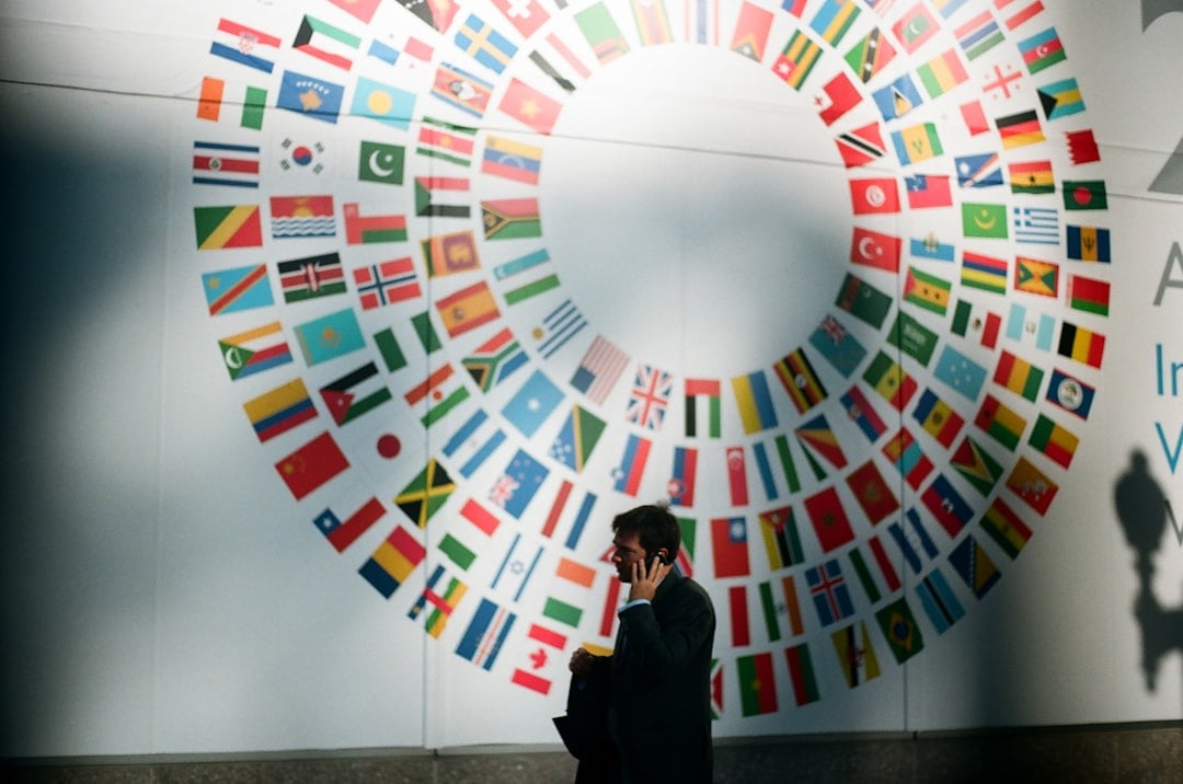 gallery-3 woman-in-black-coat-standing-near-round-white-red-and-blue-wall-k0jo8m6do6k